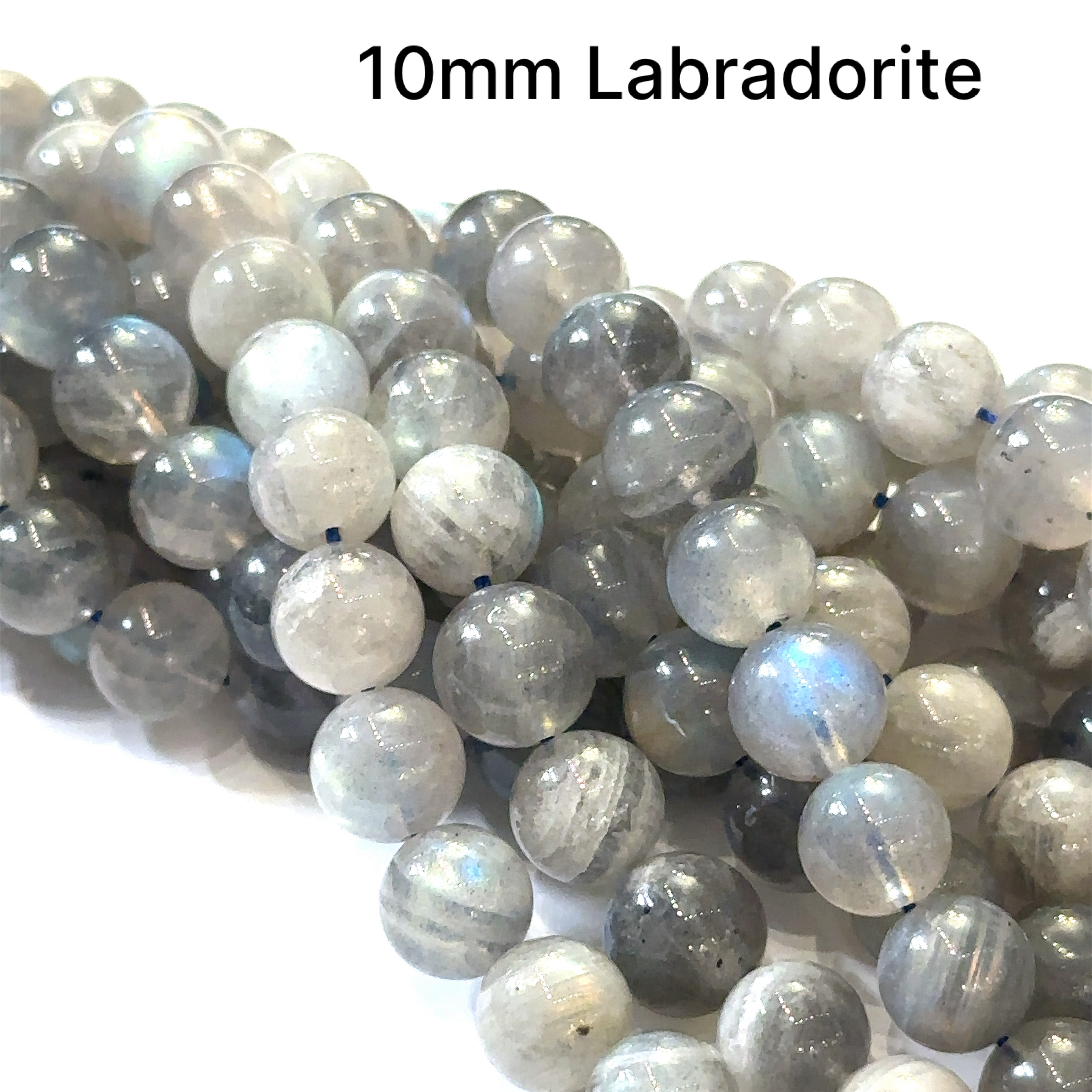 10mm smooth round Labradorite beads on a white background, front overview.