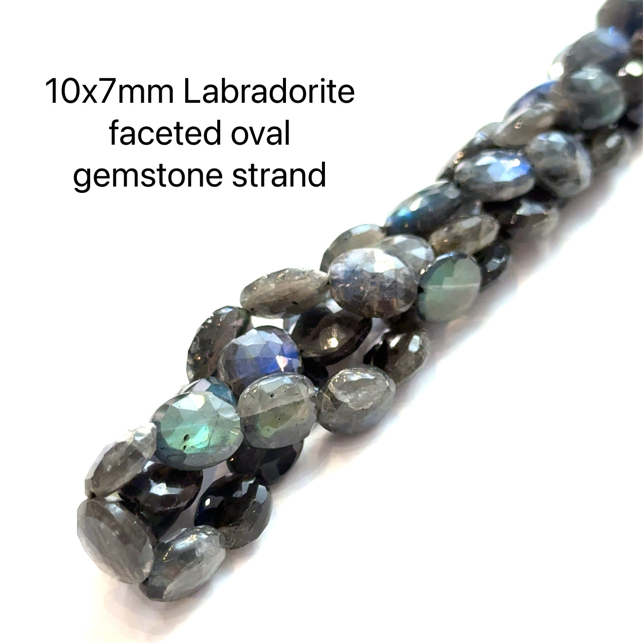 10x7mm faceted ovals Labradorite beads on a white background, front overview. 