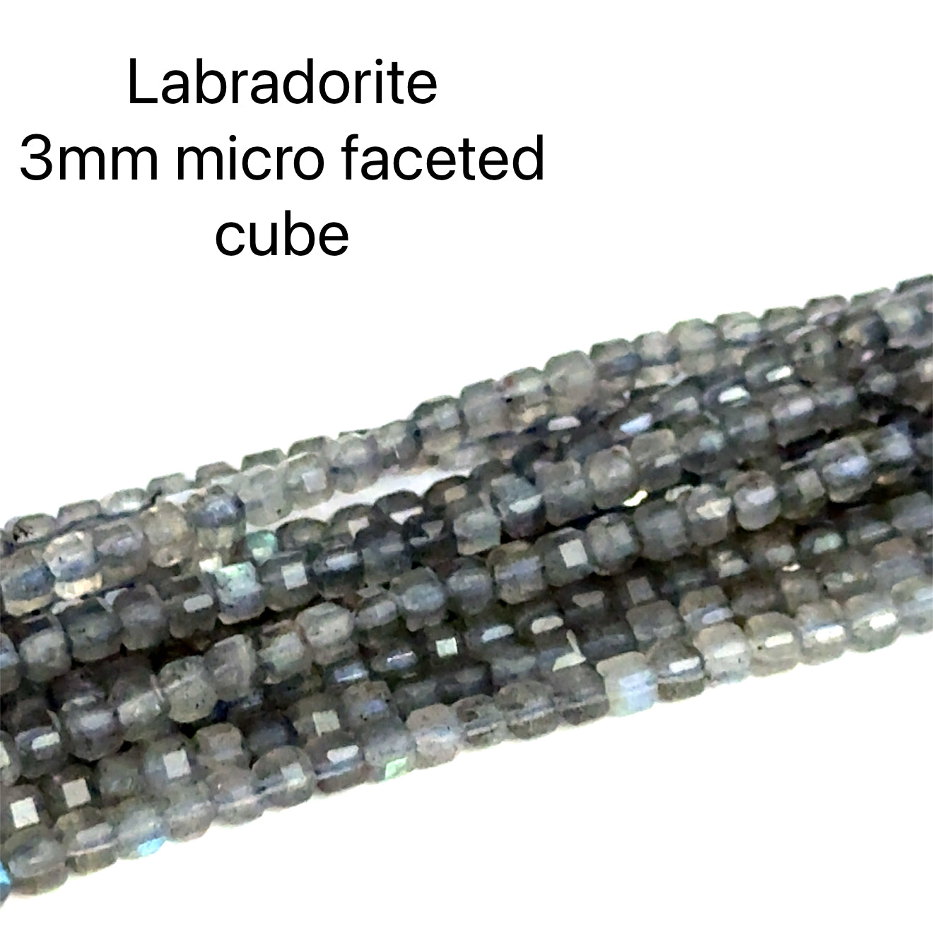 3mm micro faceted cube Labradorite beads on a white background, front overview. 