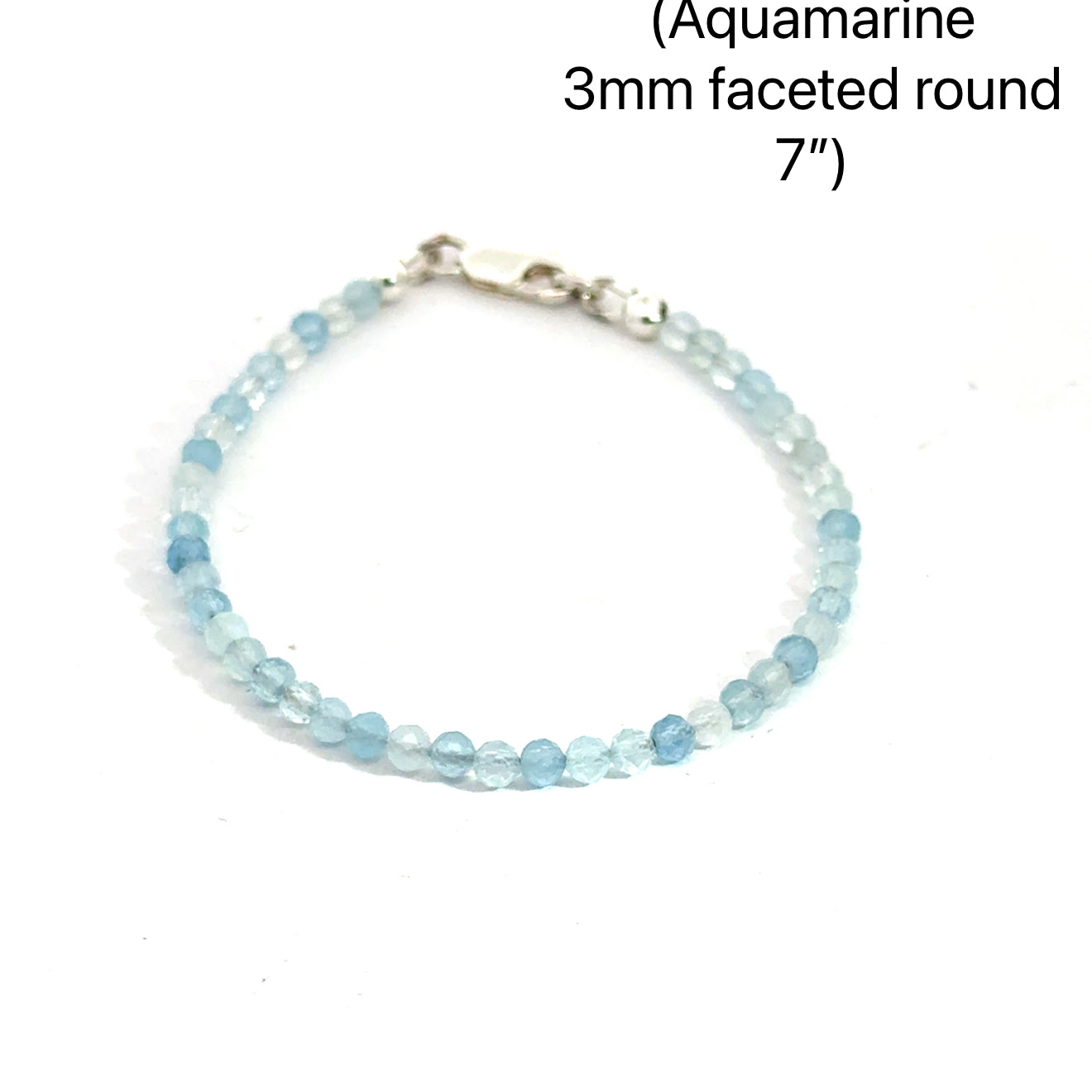 3mm micro faceted round Aquamarine gemstone beaded bracelet with sterling silver lobster claw clasp size 7'' showing pale blue translucent color on a white background front overview. 