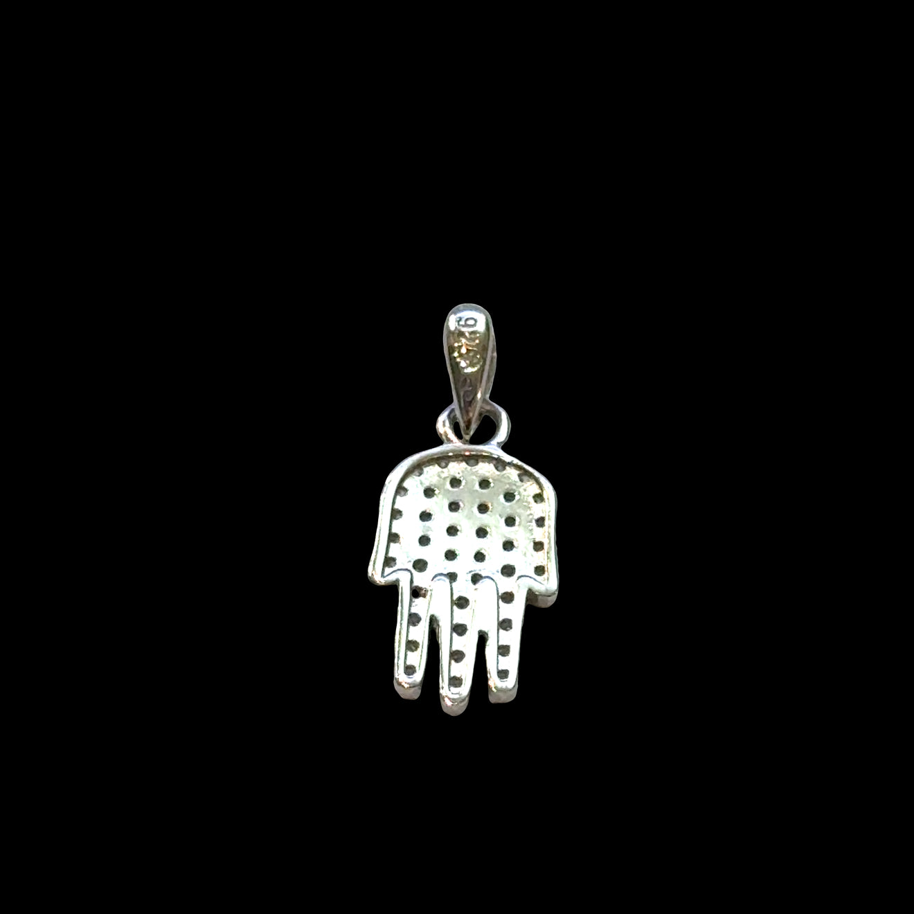 #4 Silver Hamsa hand pendant with eye design on a black background, back view.