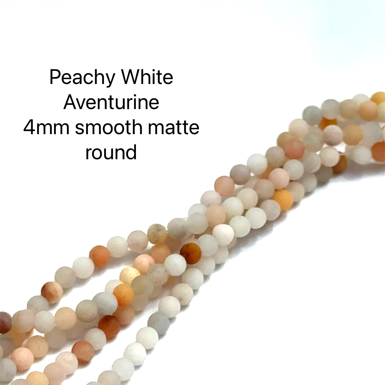 4mm White and Peach Aventurine gemstone strands displayed on a white background, overview. 