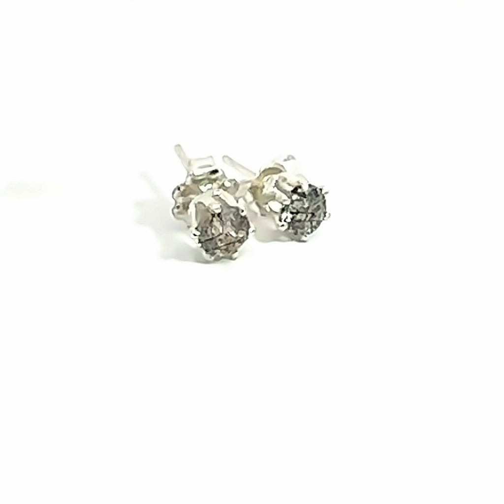 4mm faceted Rutilated Quartz stud earrings in sterling silver basket setting on a white background front overview.
