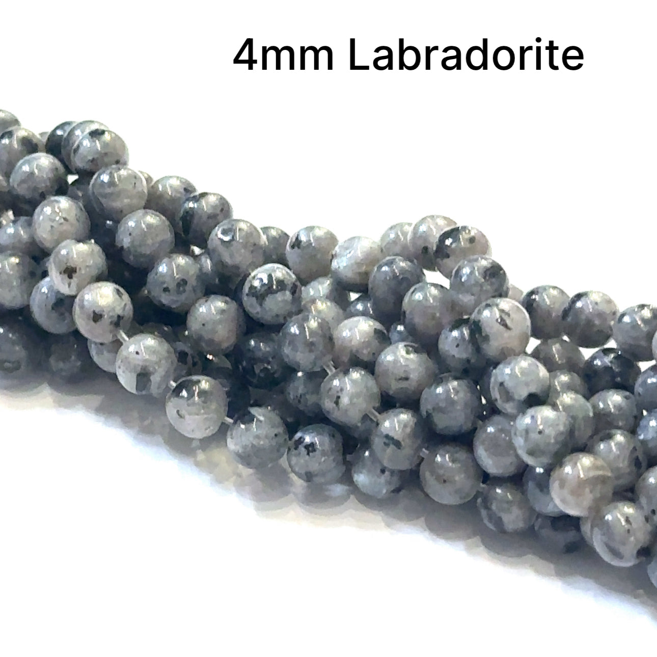 4mm round Black Labradorite beads on a white background, front overview. 
