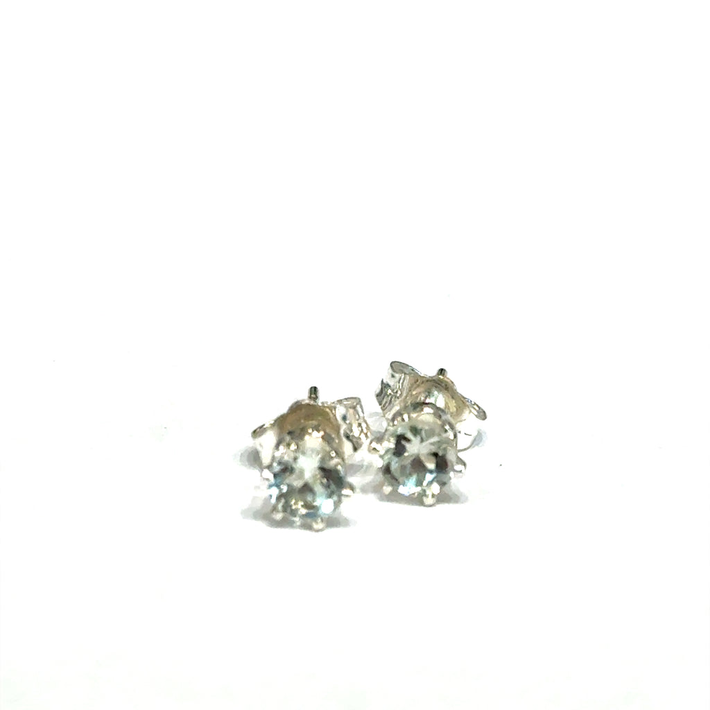 4mm round Prasiolite Green Amethyst stud earrings in sterling silver double prong setting on white background slight front overview.