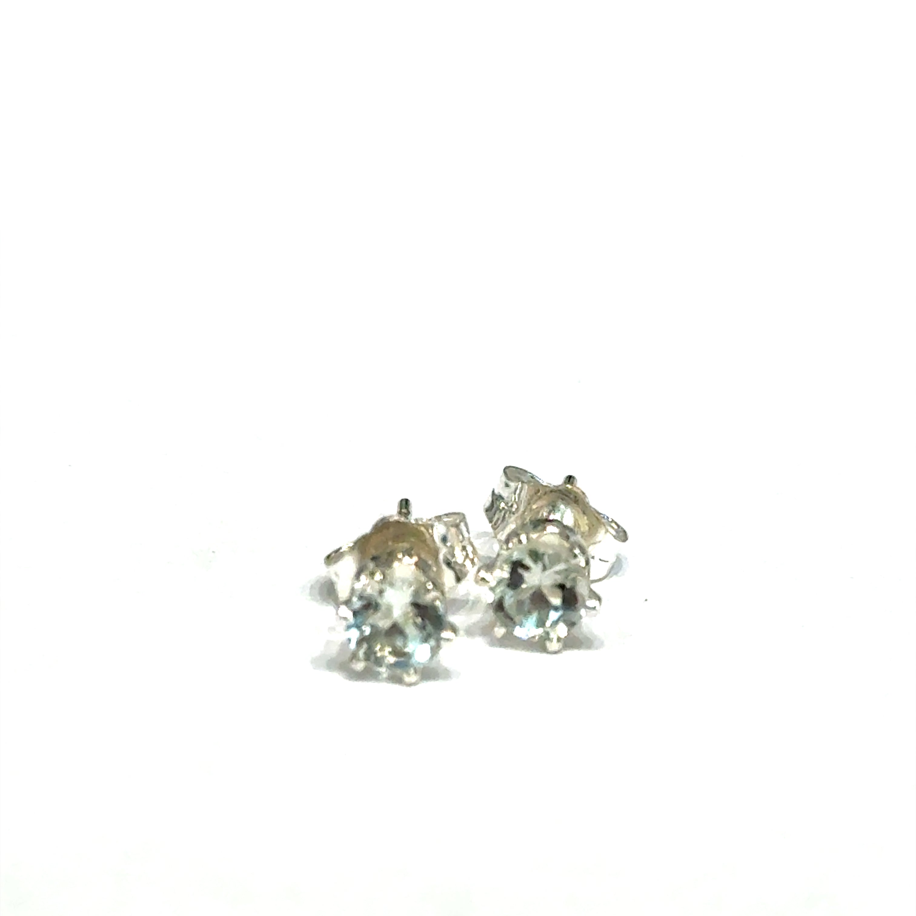 4mm round Prasiolite Green Amethyst stud earrings in sterling silver double prong setting on white background slight front overview.