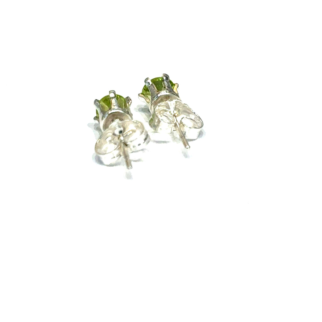 4mm round faceted Peridot stud earrings in sterling silver double prong setting on a white background  back overview
