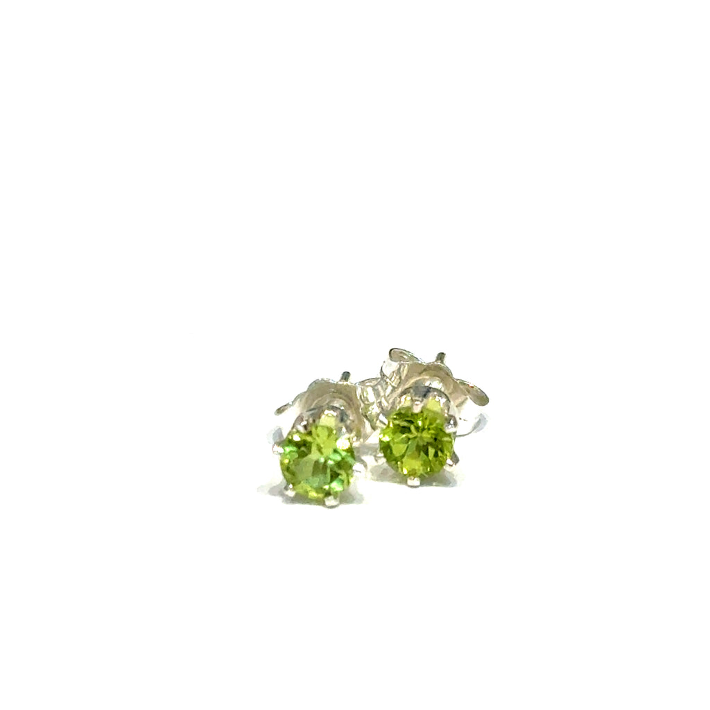 4mm round faceted Peridot stud earrings in sterling silver double prong setting on a white background  front overview