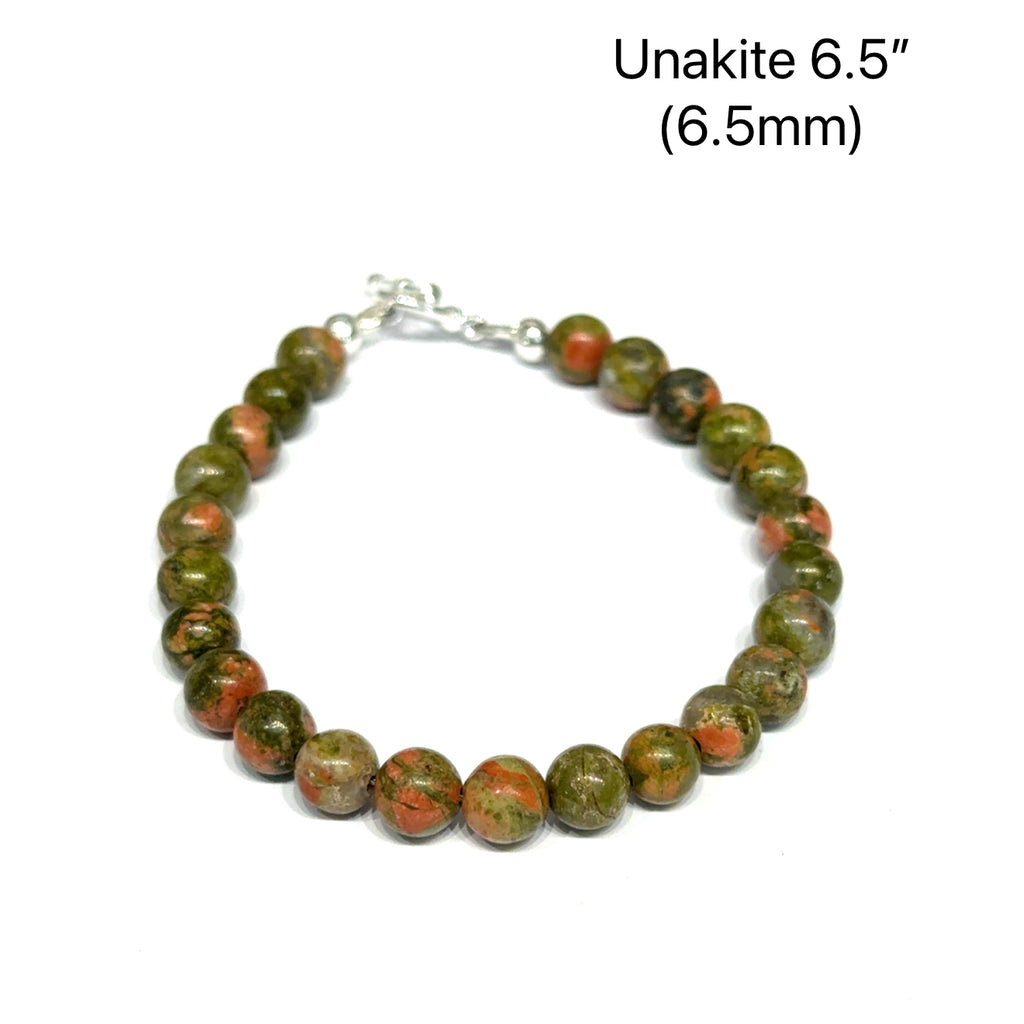6.5'' Unakite beaded bracelet with 6mm smooth round gemstones and a sterling silver toggle clasp for gentle emotional healing, on a white background, front view. 