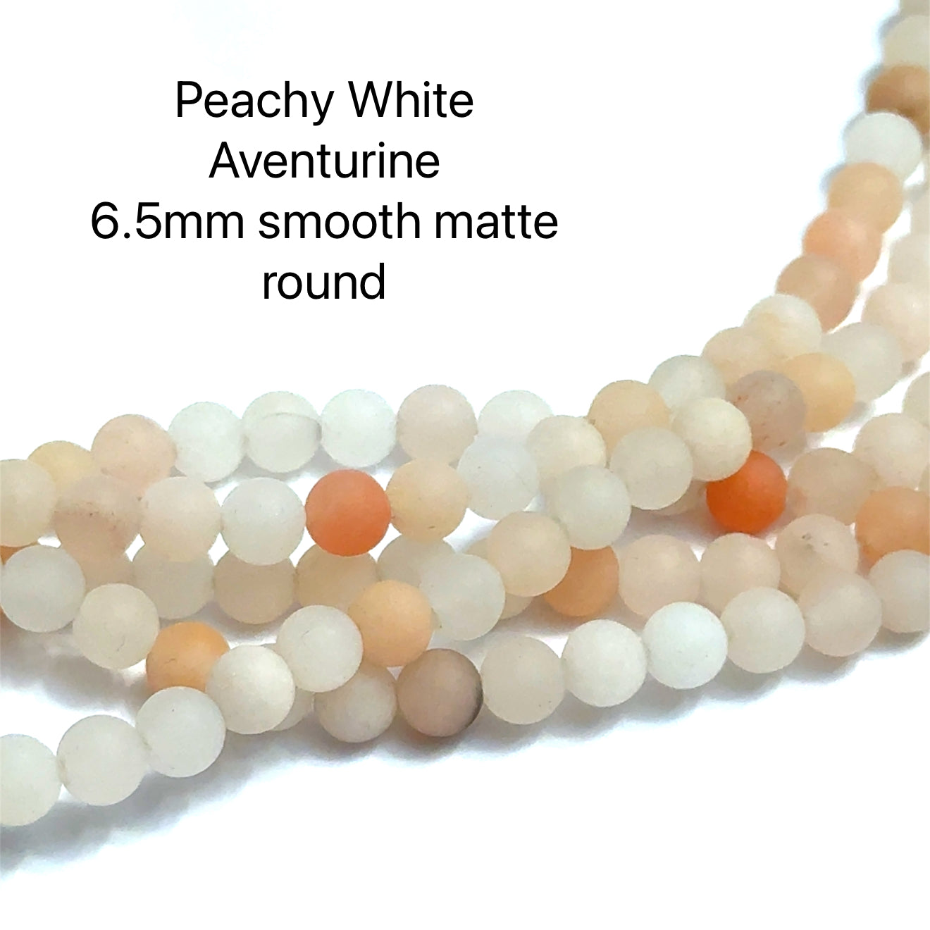 6.5mm White and Peach Aventurine gemstone strands displayed on a white background, overview. 