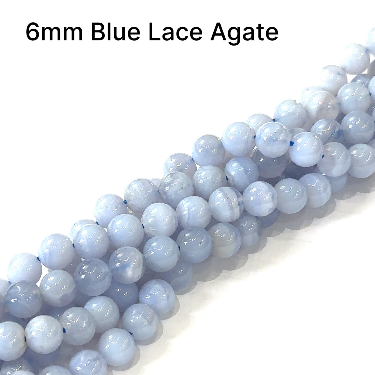 6mm Blue lace Agate smooth round gemstones on a white background, front overview. 
