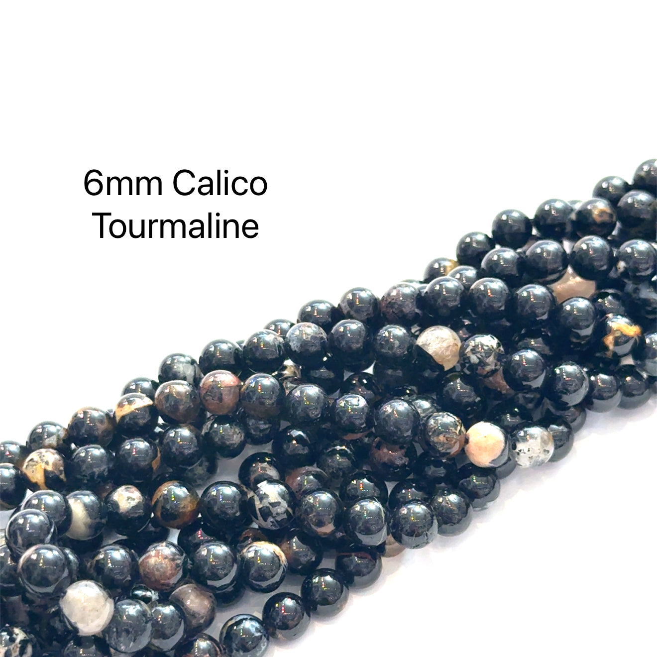 6mm Calico Tourmaline smooth round gemstone strand, on a white background, front view. 