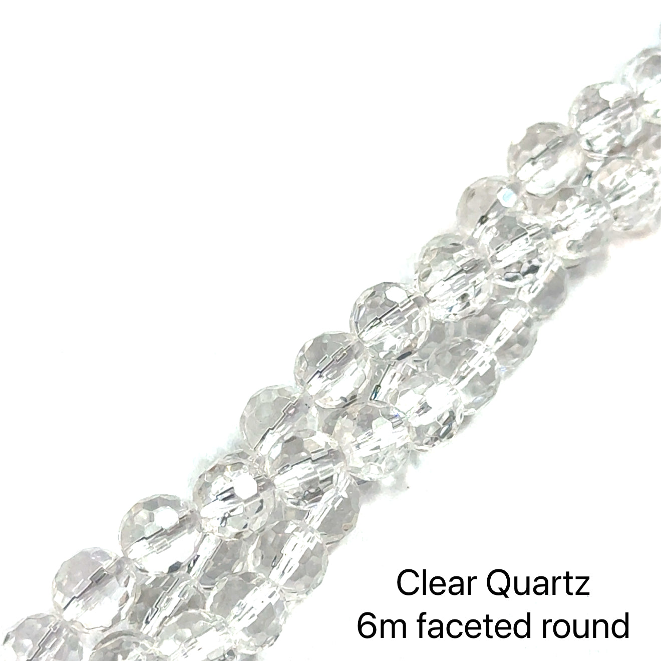6mm Clear Quartz faceted round gemstone strand on a white background, overview. 