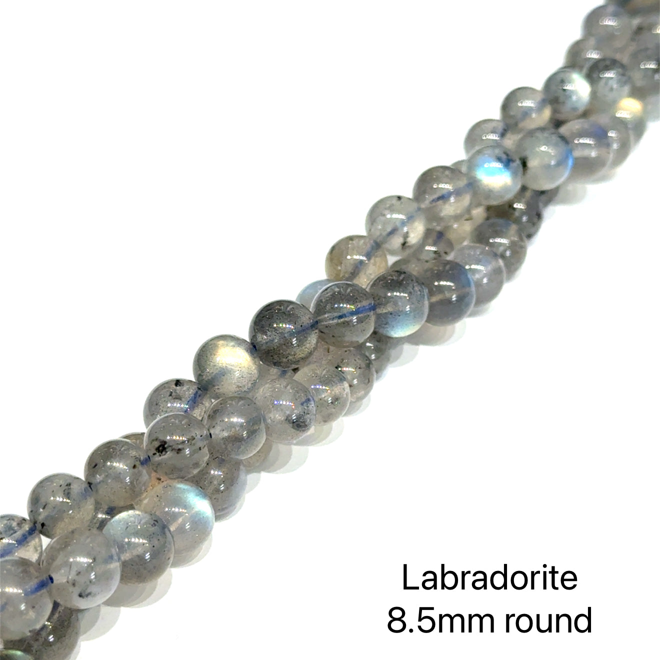 8.5mm smooth round Labradorite beads on a white background, front overview. 