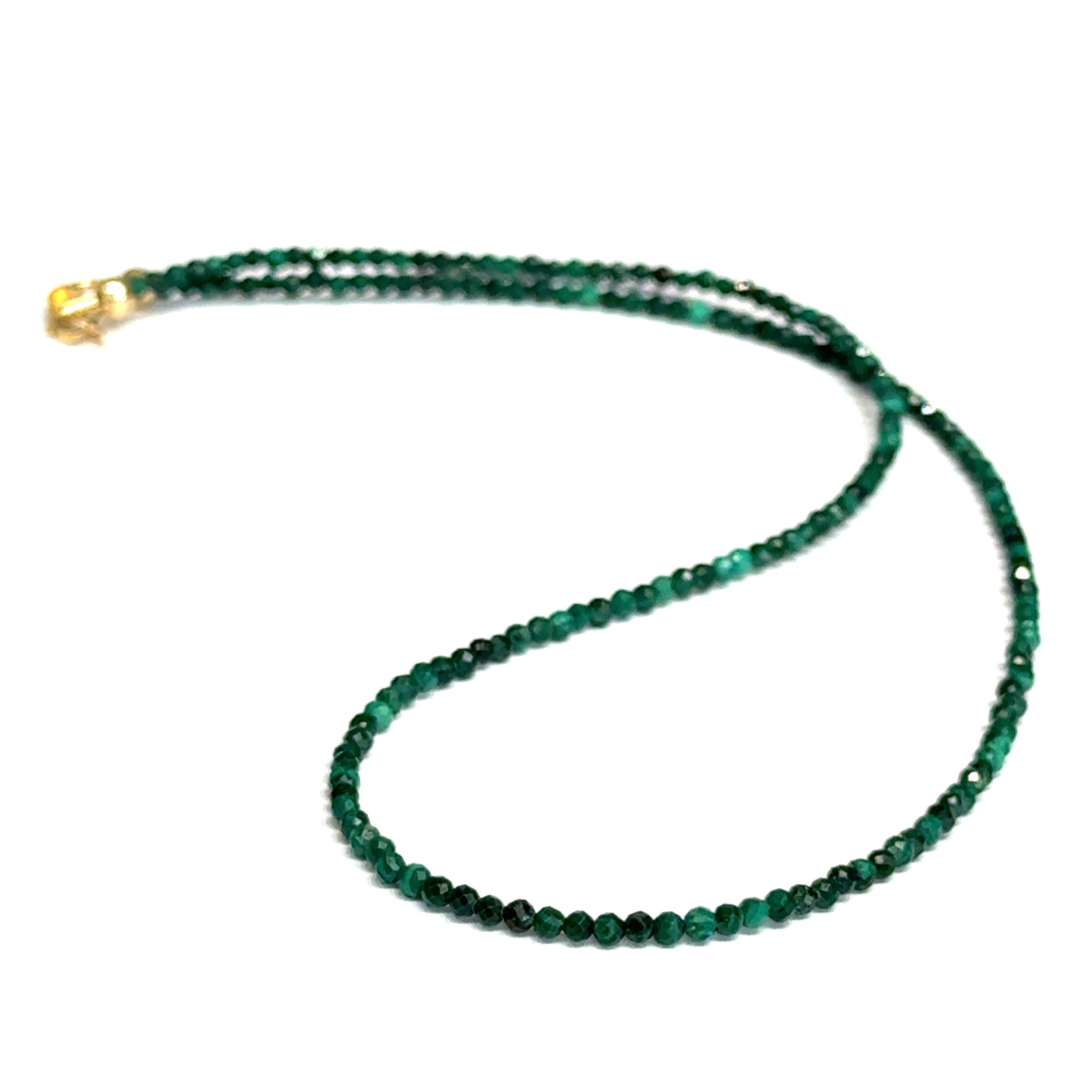 A 2mm faceted round malachite gemstone necklace with gold-filled lobster claw clasp on white background, long overview. 