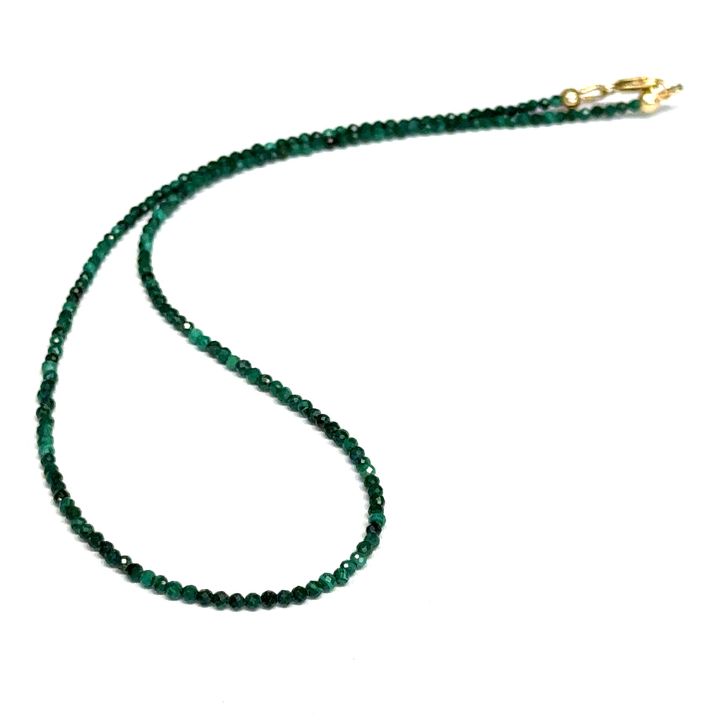 A 2mm faceted round malachite gemstone necklace with gold-filled lobster claw clasp on white background, long view.