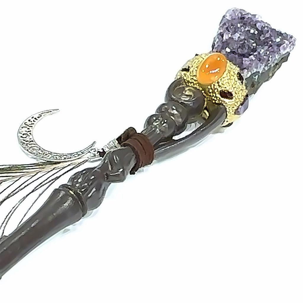 A Amethyst gemstone wand  on a white background front view.