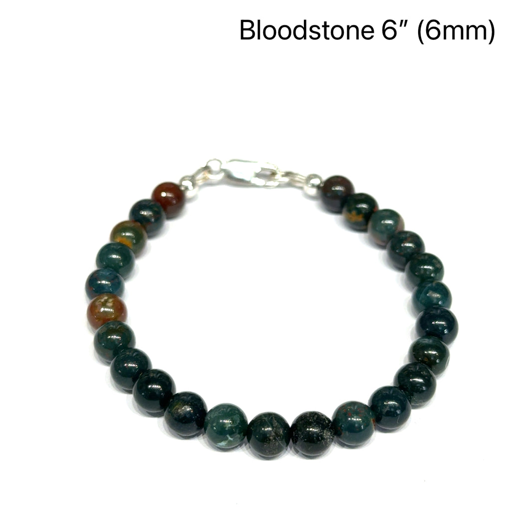 A Bloodstone beaded bracelet with 6mm smooth round gemstones and sterling silver lobster claw clasp size 6'' for courage and vitality on a white background, front overview. 