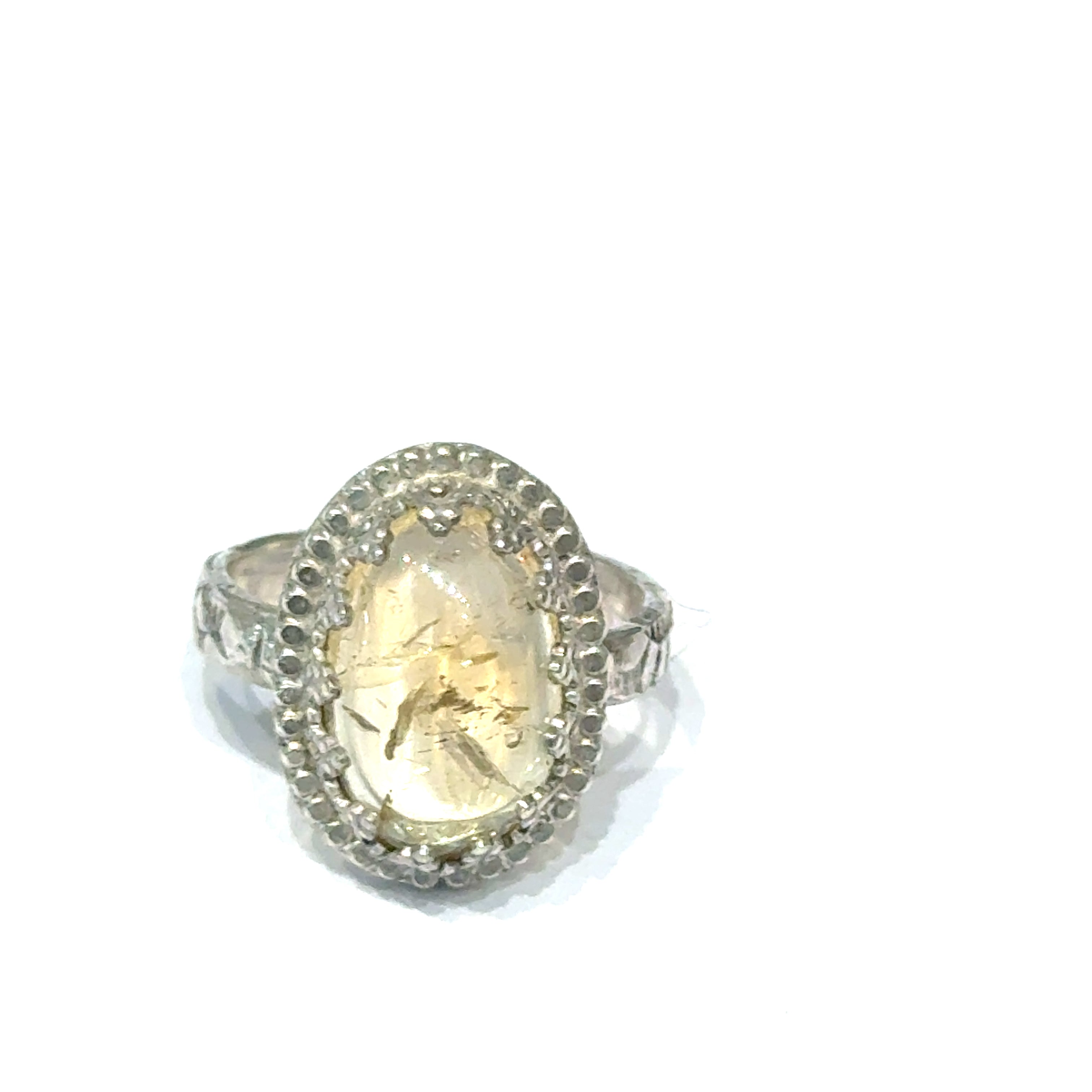 A Citrine Gemstone ring in sterling silver a vintage style on a white background front, close up view. 