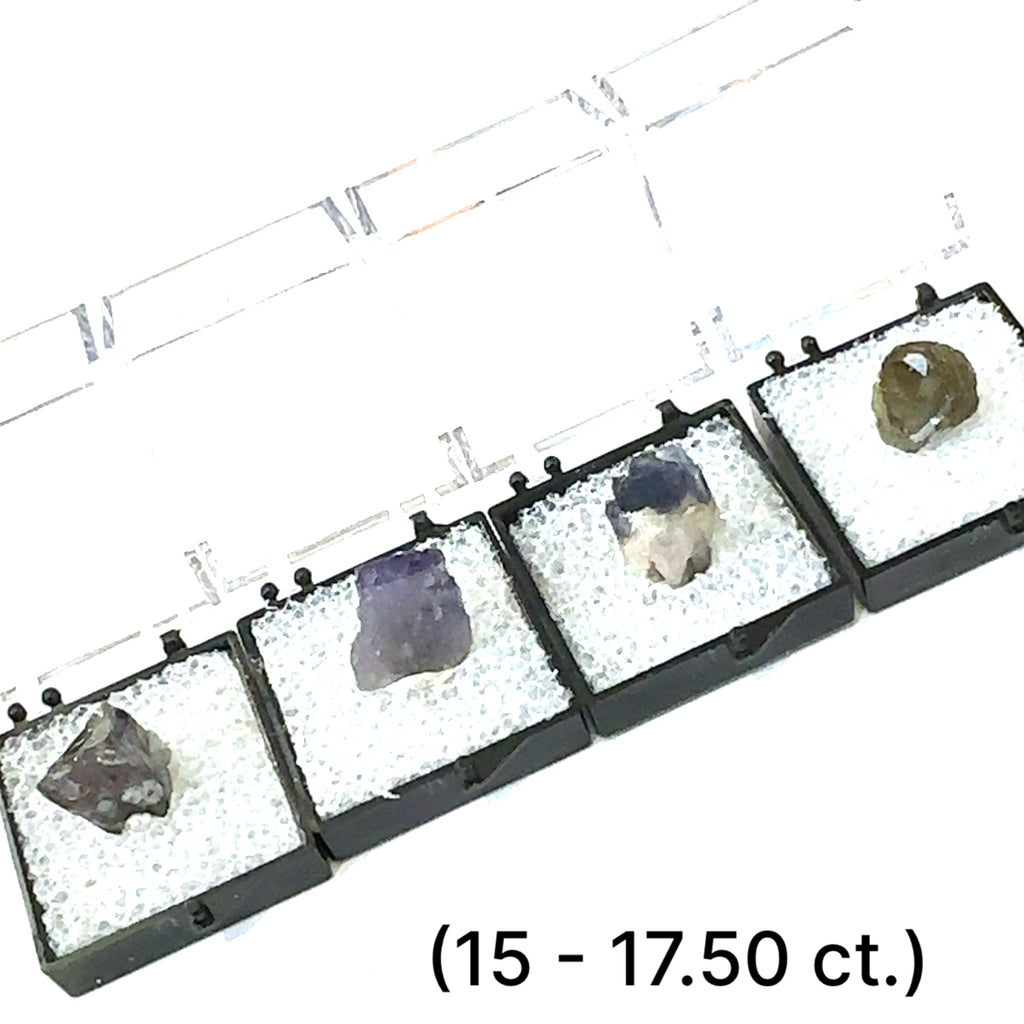 A Close-up of Tanzanite crystal in perky boxes showing deep violet-blue hues, on a white background, front view. size (15.-17.50ct) gem grade.