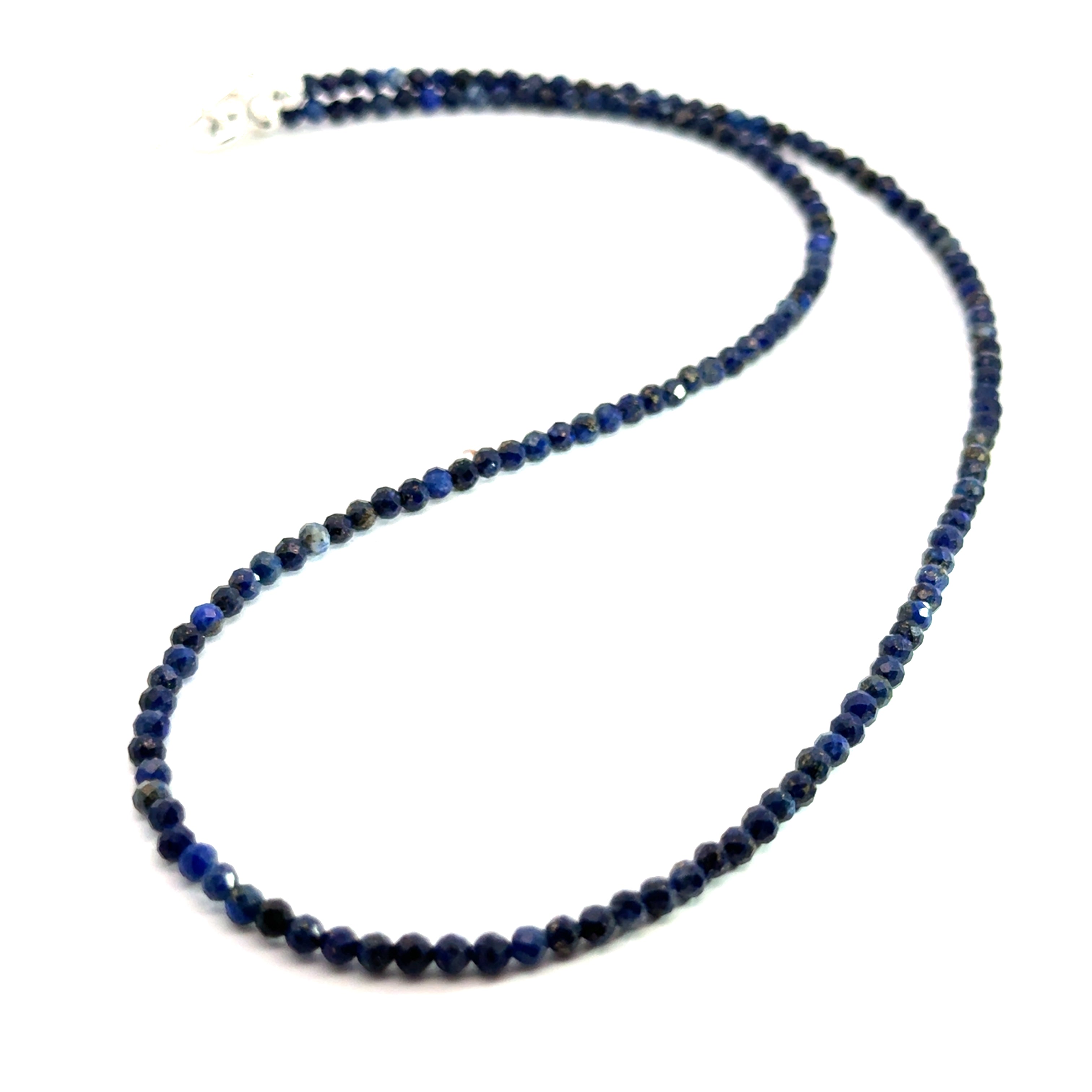 A Lapis Lazuli gemstone beaded necklace on a white background long overview, front overview. 