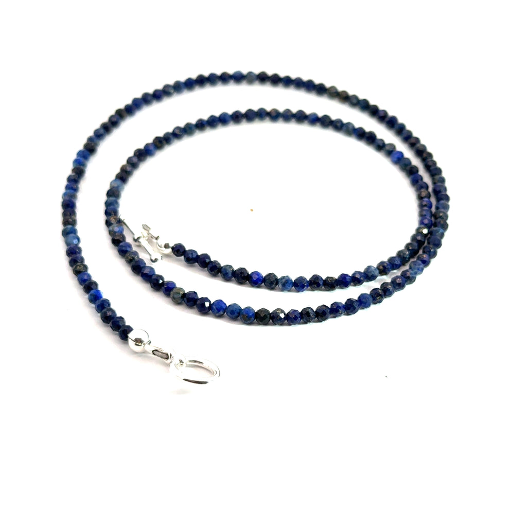 A Lapis Lazuli gemstone beaded necklace white background long overview, front, spiral  overview toggle view. 