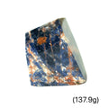 A Orange Sodalite freeform gemstone (137.9g) on a white background, front view.