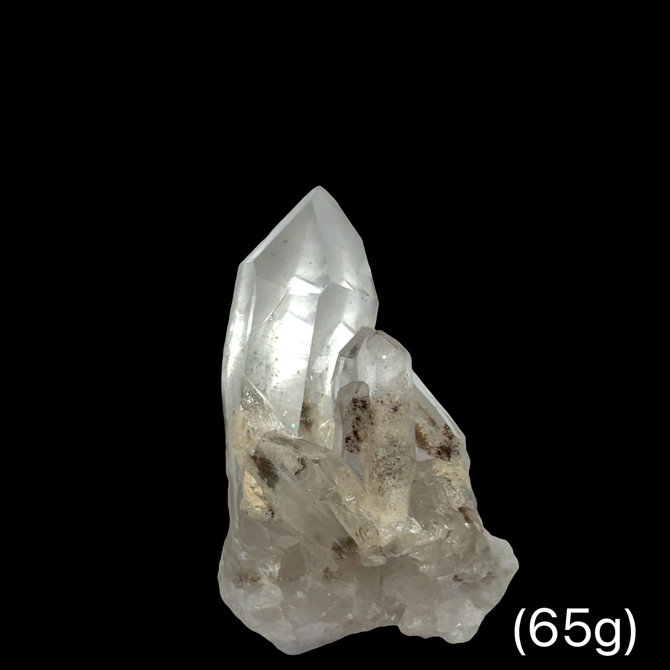 A Quartz crystals with phantoms and inclusions (65g) on a black background, front view.