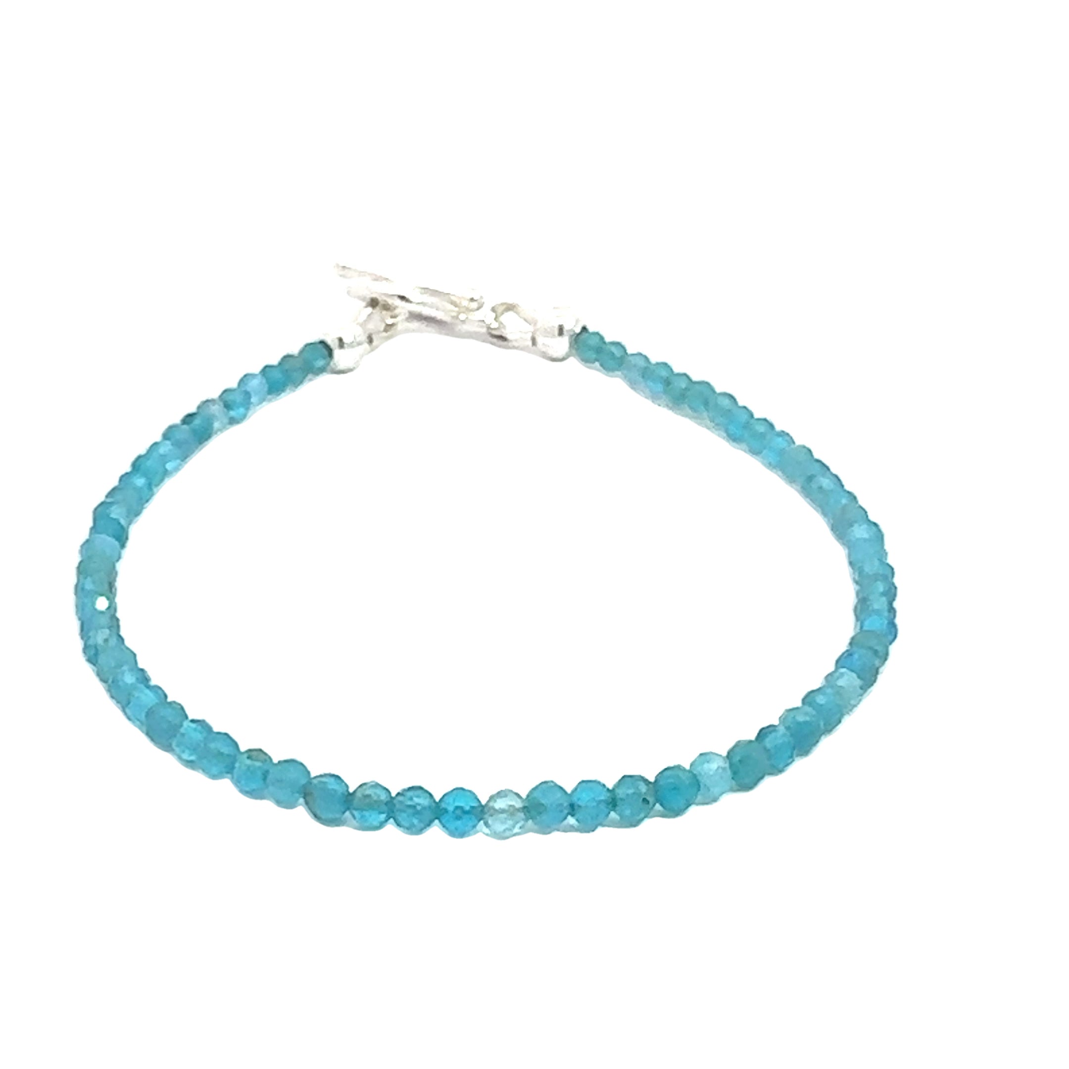A blue Apatite 2mm faceted beaded gemstone bracelet with sterling silver toggle, displayed against a white background, front center overview.