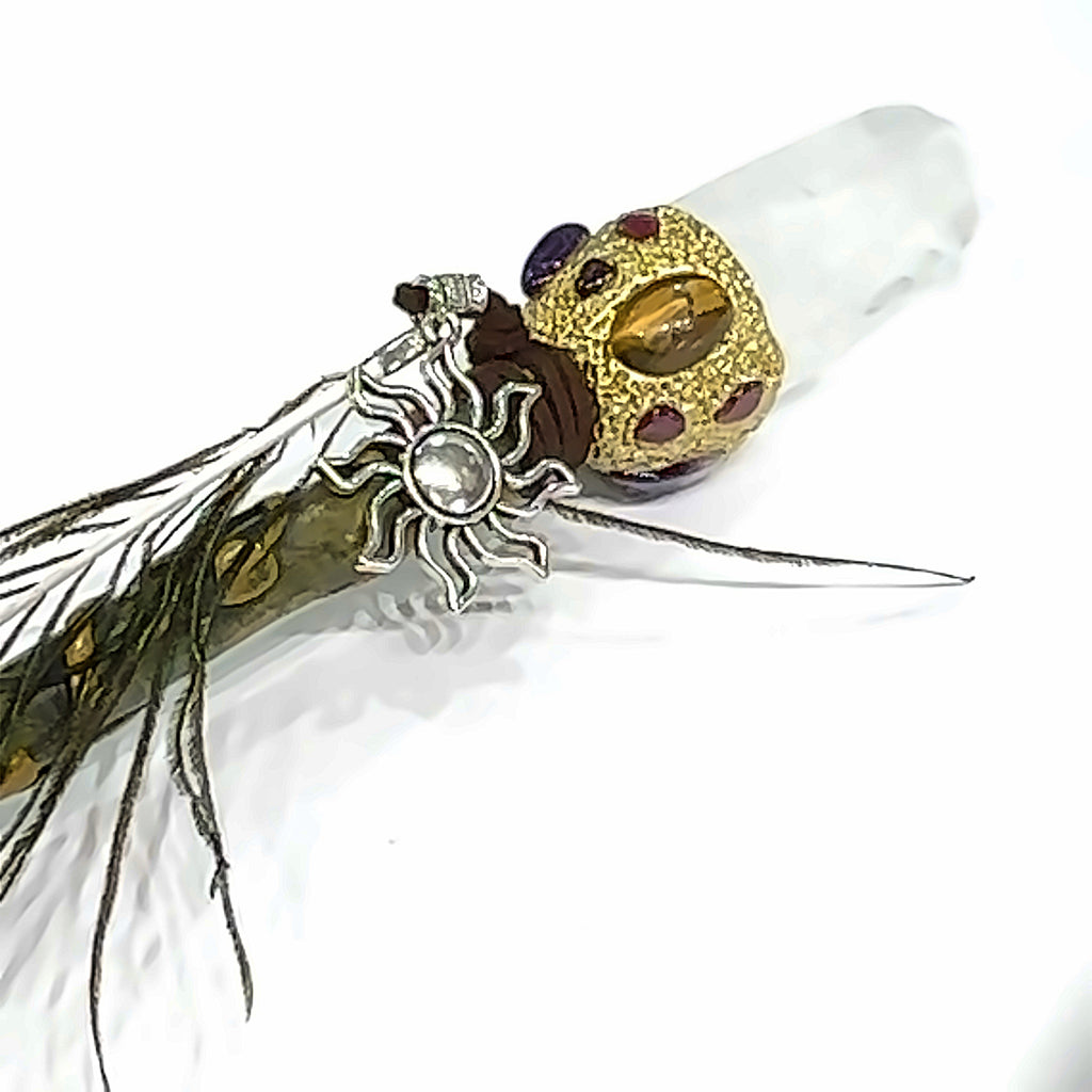 A clear Quartz gemstone wand  on a white background front view.