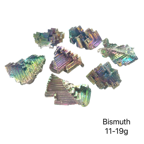 A cluster of bismuth gemstones  (11-19g) on a white background, close-up overview.