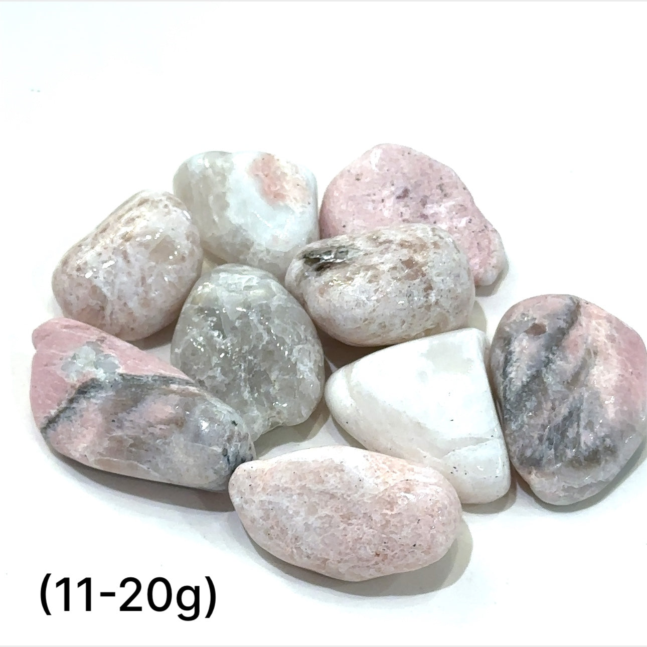 A collection of (11-20g) tumbled Petalite gemstones with a pink hue, displayed   on a white background, front overview.