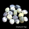 A collection of Chytha gemstone weighing at (0-10g) on a black background, front overview.