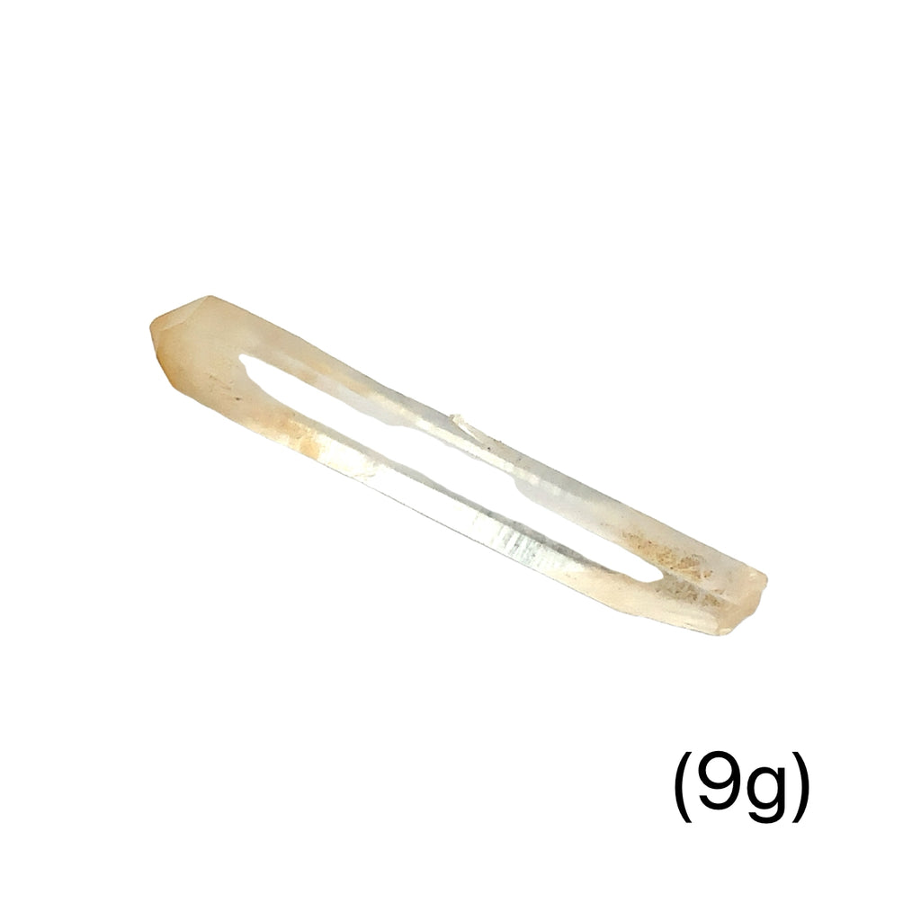 A collection of Halloysite-Included Quartz gemstones, also known as 'Mango Quartz', in sizes (9g) Bis displayed on a white surface center overview.