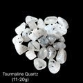 A collection of Tourmalinated Quartz tumbled gemstones displayed on a Black background, (11-20g) weight range, front overview.