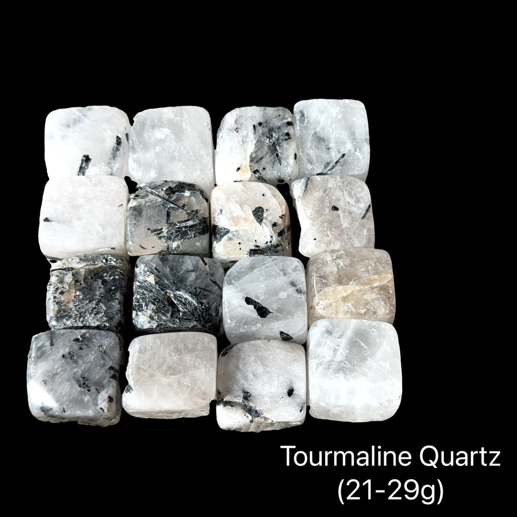 A collection of Tourmalinated Quartz tumbled gemstones displayed on a Black background, (21-29g) weight range, front overview.