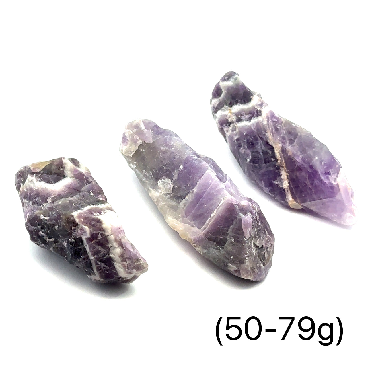 A collection of raw Amethyst or Prasiolite gemstones size (50-79g) on a white background, front view.