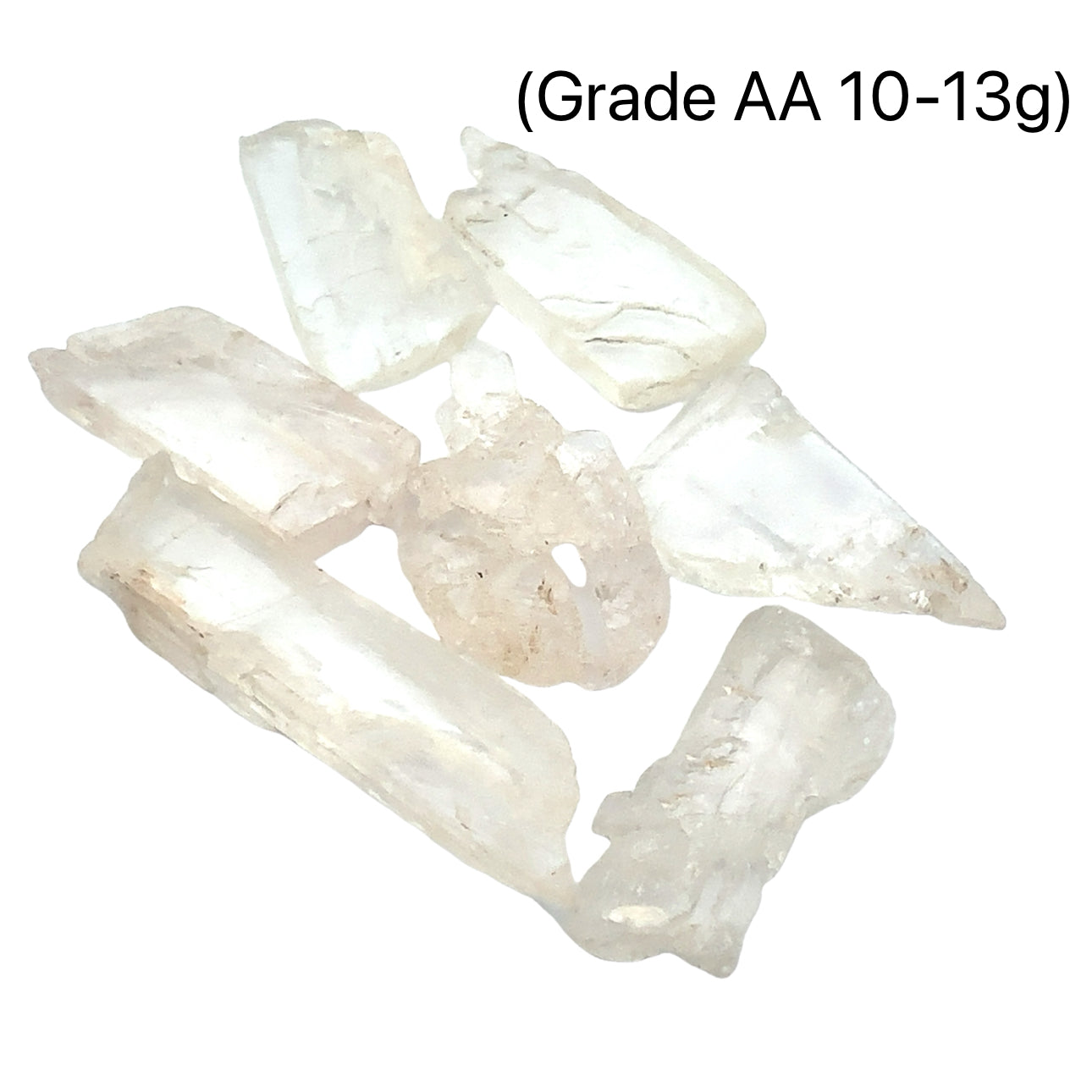 A collection of raw Hiddenite gemstones displayed on a white surface. (grade AA 10-13g) front overview. 
