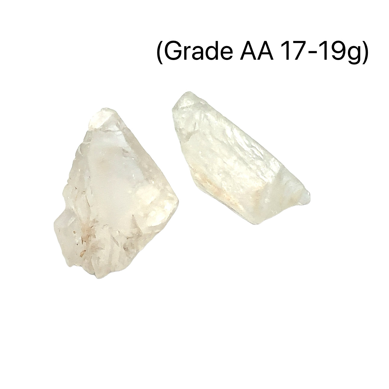 A collection of raw Hiddenite gemstones displayed on a white surface. (grade AA 17-19g) front overview. 