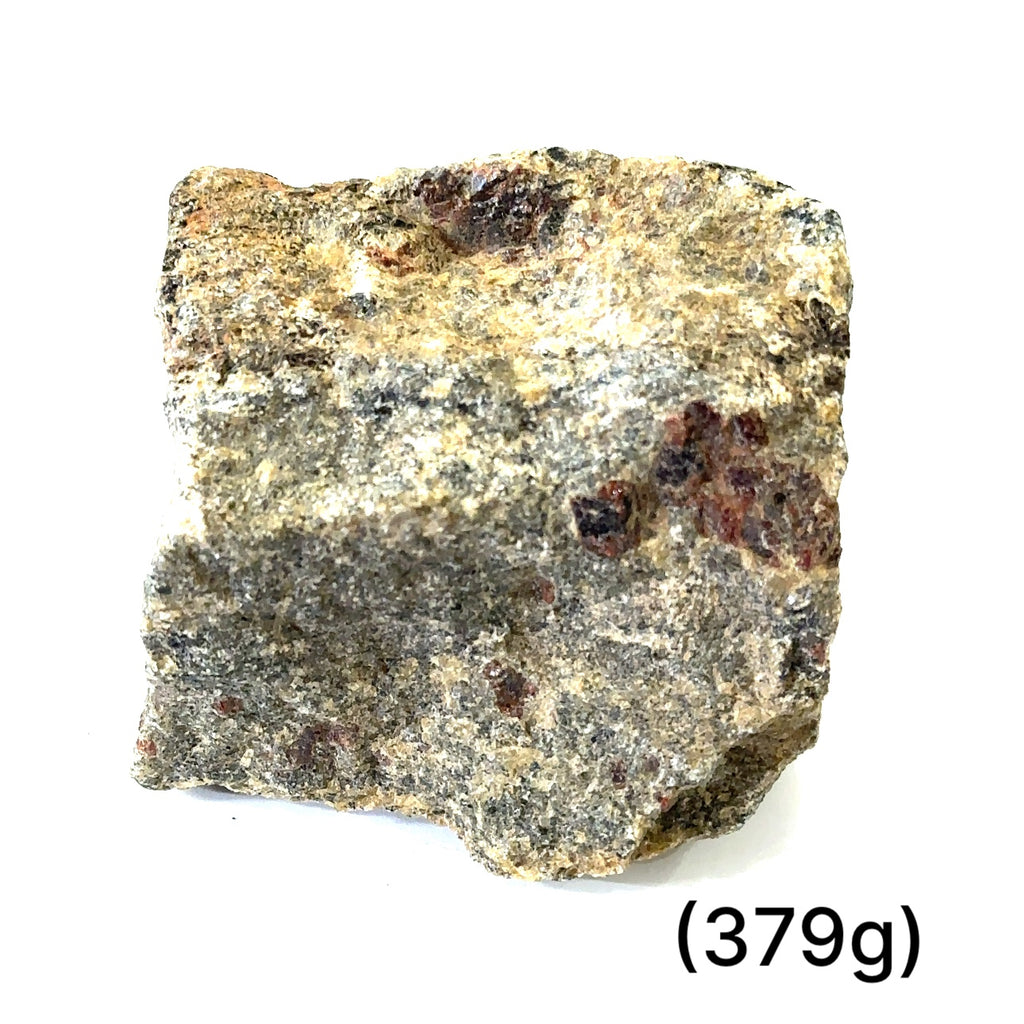 A collection of raw garnet gemstones with a rough, rugged texture in a natural color range of red and brown. On white (379g) front view