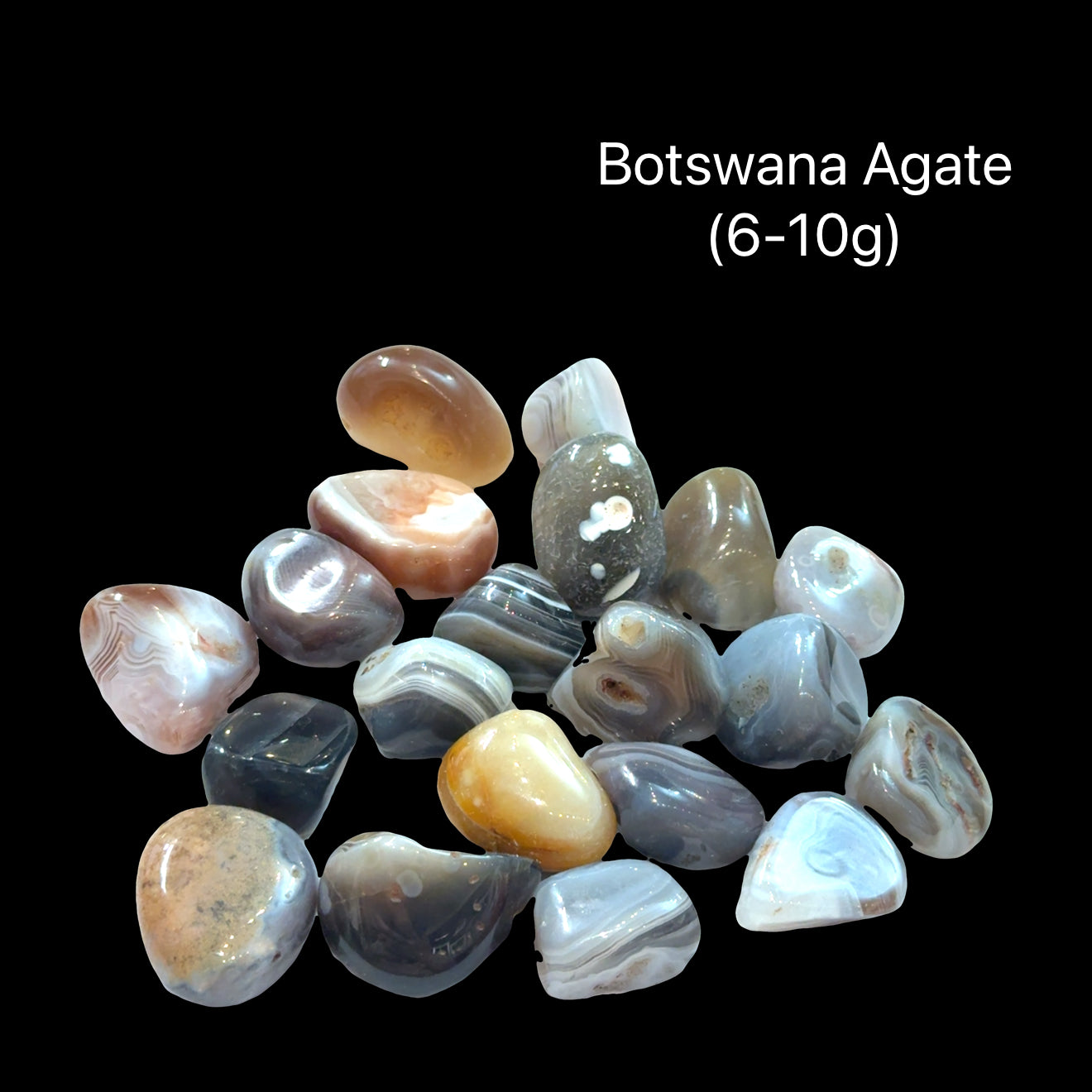 A collection of tumbled Botswana Agate gemstones on a Black background, (6-10g) front view.