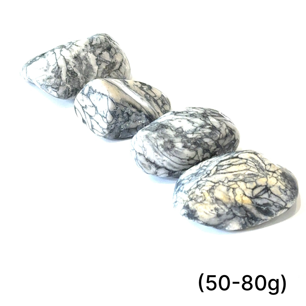 A collection of tumbled Pinolith gemstones (50-80g) displayed on a white background, with varying shades of gray and white patterns.