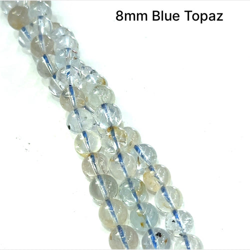A group of 8mm Blue Topaz smooth round gemstone strand. on a white background front overview. 