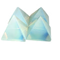A group of Opalite Gemstone Pyramid – glowing iridescent crystal for peace and clarity on a white background front overview. 