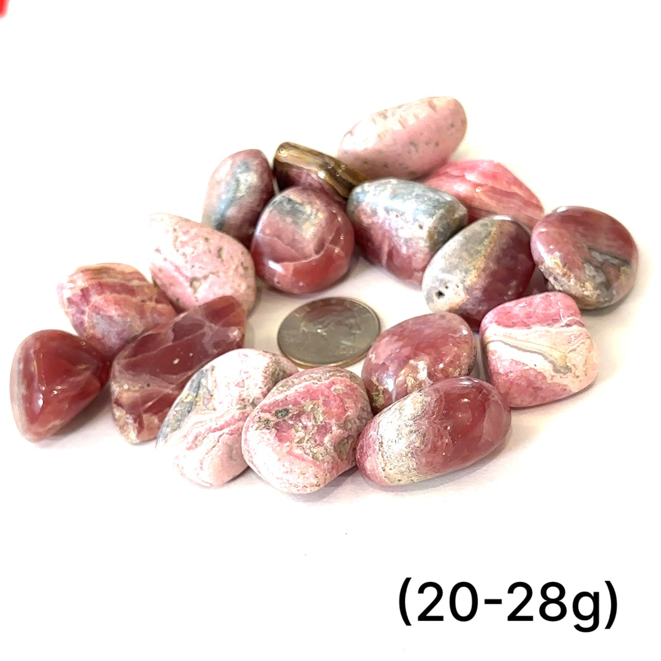A group of Rhodochrosite tumbled weighing (20-28g) on a white background, front view.  