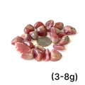 A group of Rhodochrosite tumbled weighing (3-8g) on a white background, front view.  