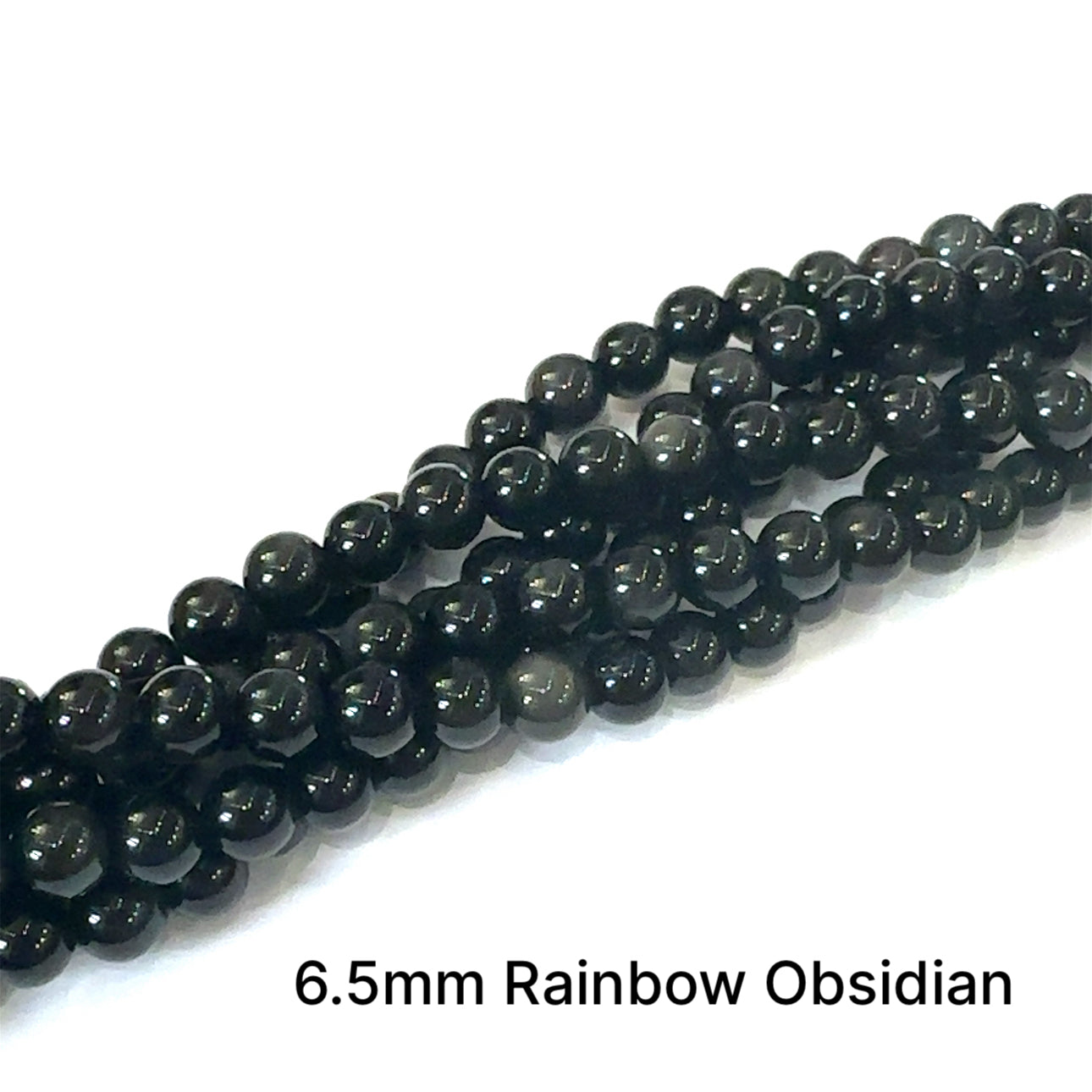 A group of strands of 6.5mm Rainbow Obsidian smooth round gemstone beads on a white background, front overview. 