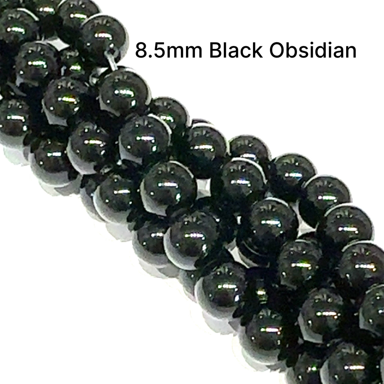 A group of strands of 8.5mm Black Obsidian smooth round gemstone beads on a white background, front overview. 