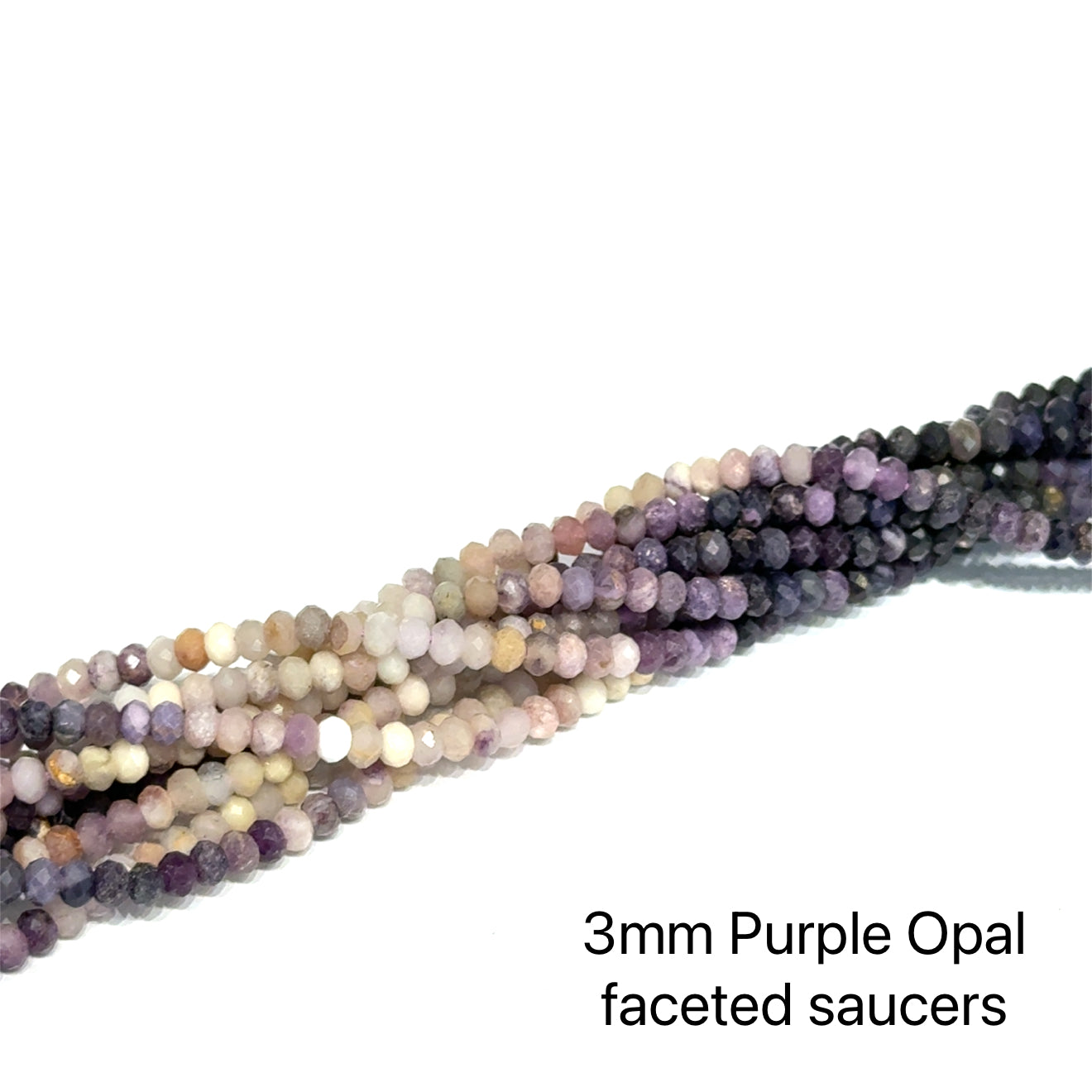 A grouping of strands of 3mm purple opal faceted saucers on a white background, front overview. 