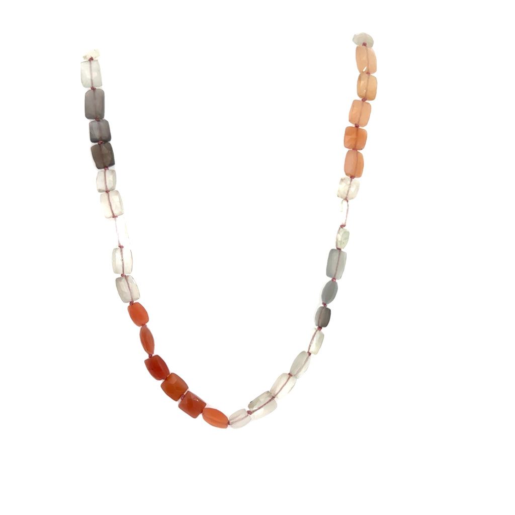 A knotted necklace made of mixed moonstone gemstones with a sterling silver toggle clasp on a white background, long hanging overview 